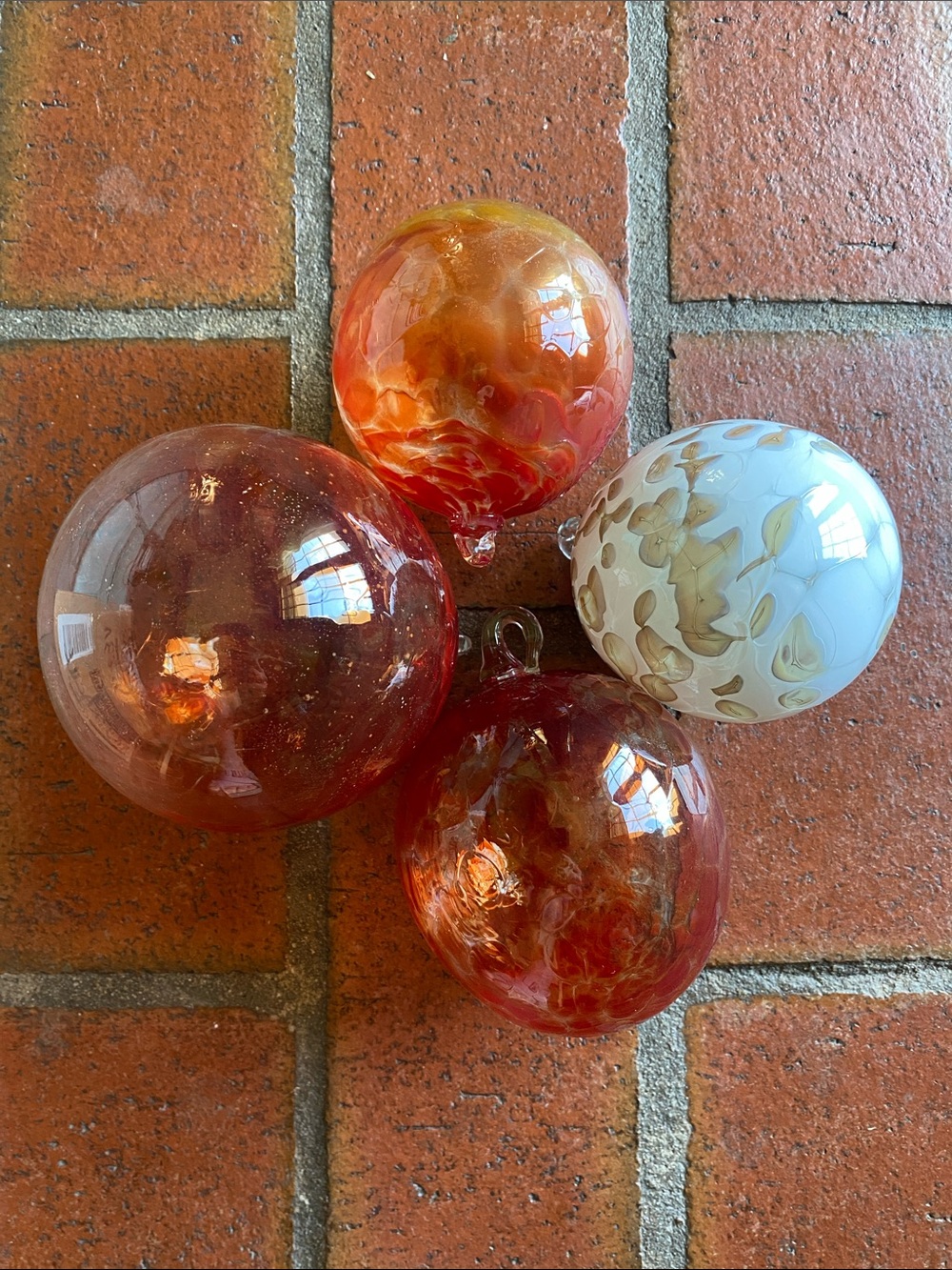 Set of 4 Handblown Glass Spheres (1 white/clear, 3 orange/clear fade)